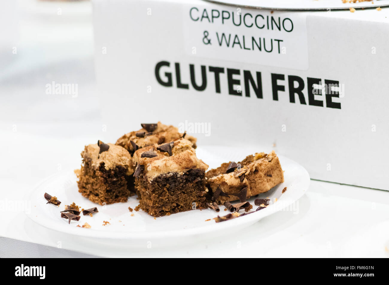 Gluten Free Cappuccino and Walnut Cake on sale in an up-market cafe. Stock Photo