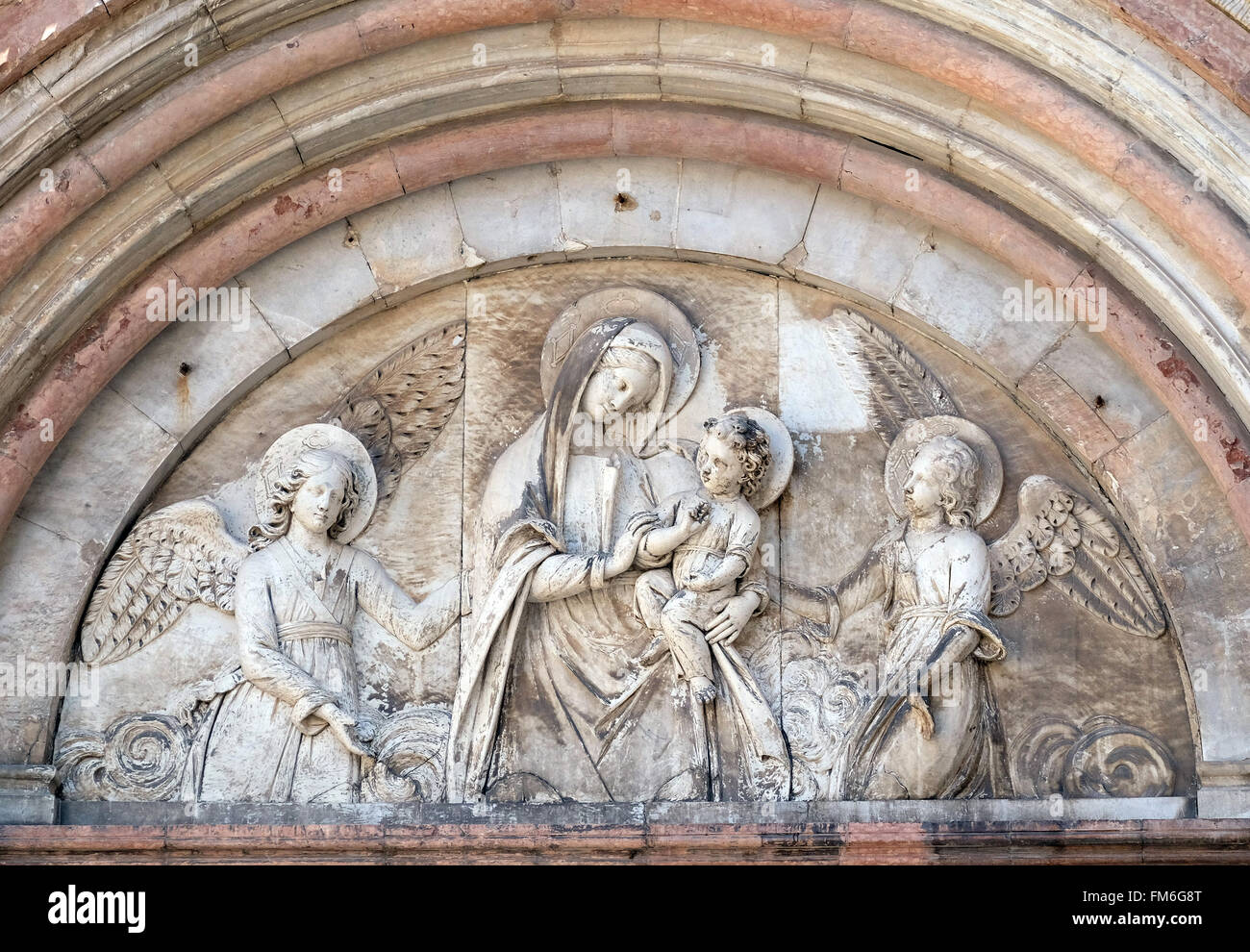 Basrelief representing the Virgin Mary with baby Jesus between angels
