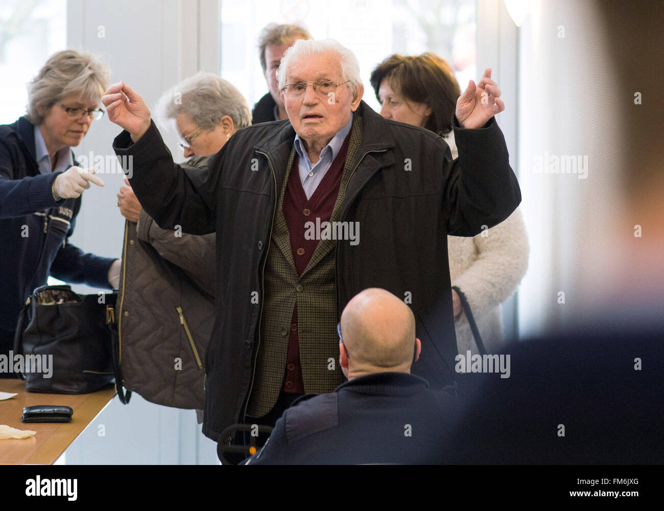 Detmold, Germany. 11th Mar, 2016. Witness Jakob Wendel arrives for the continuation of his trial in Detmold, Germany, 11 March 2016. Reinhold Hanning, a 94-year-old World War II SS guard is facing a charge of being an accessory to at least 170,000 murders at Auschwitz concentration camp. Prosecutors state that he was a member of the SS 'Totenkopf' (Death's Head) Division and that he was stationed at the Nazi regime's death camp between early 1943 and June 1944. Photo: Bernd Thissen/dpa/Alamy Live News Stock Photo