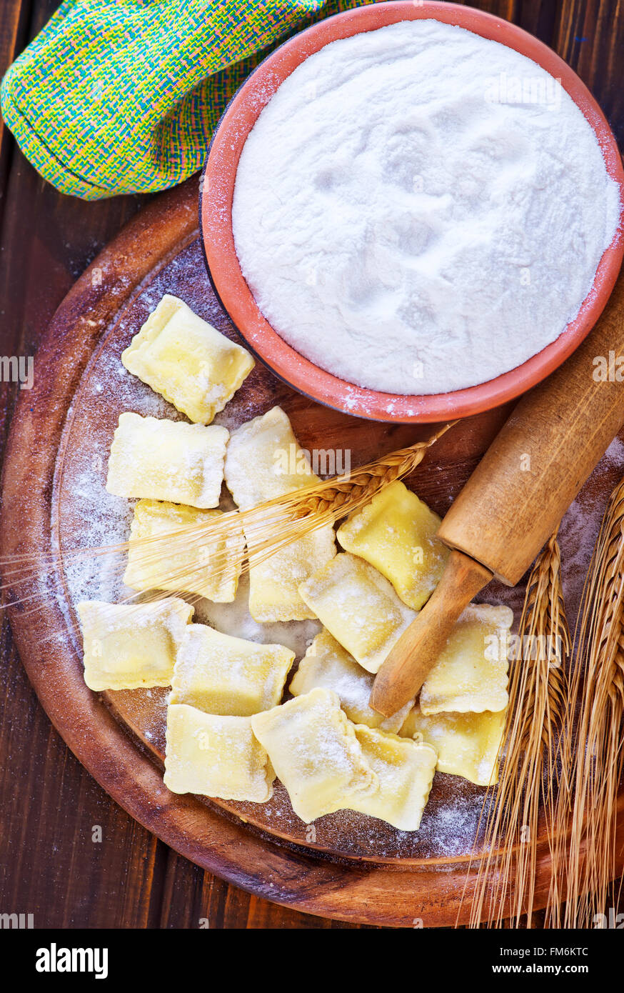 raw ravioli and flour on a table Stock Photo - Alamy