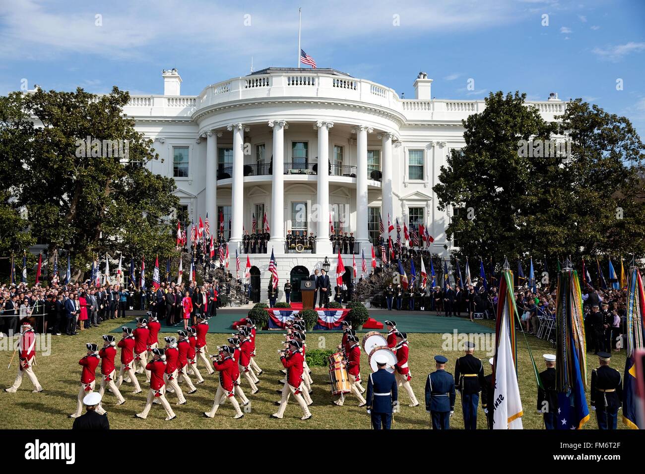 U.S. President Barack Obama and Canadian Prime Minister Justin Trudeau view the Army Old Guard Fife and Drum Corps parade during the State Arrival ceremony on the South Lawn of the White House March 10, 2016 in Washington, DC. This is the first state visit by a Canadian Prime Minister in 20-years. Stock Photo