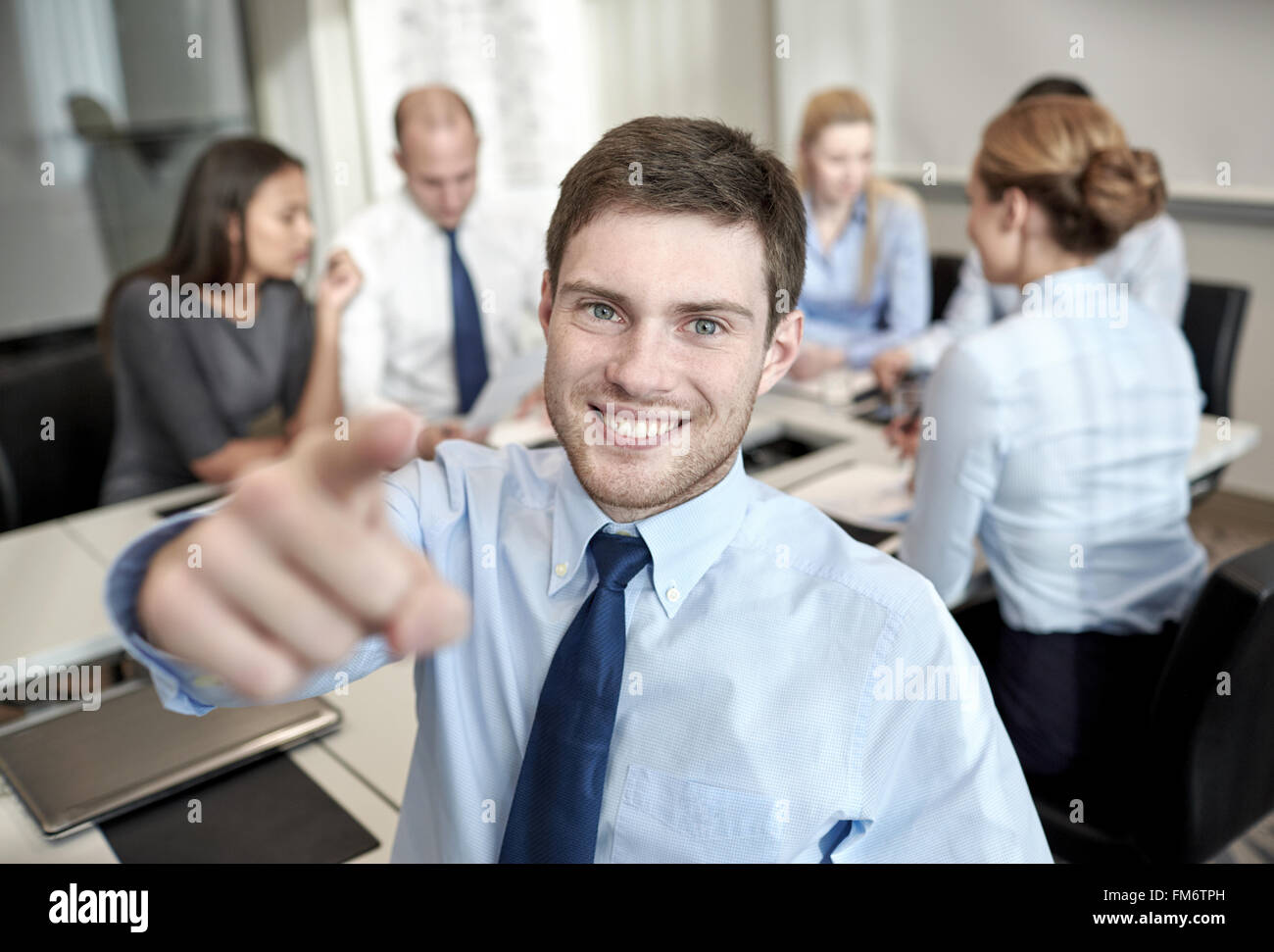 group of smiling businesspeople meeting in office Stock Photo - Alamy