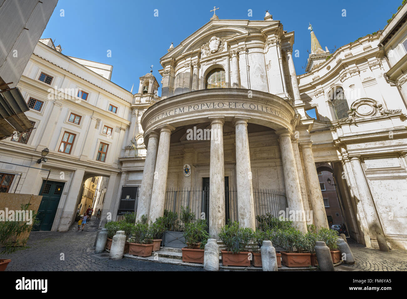 Rome, Italy - August 22, 2015: nice little square in Rome with church  people walking in background Stock Photo