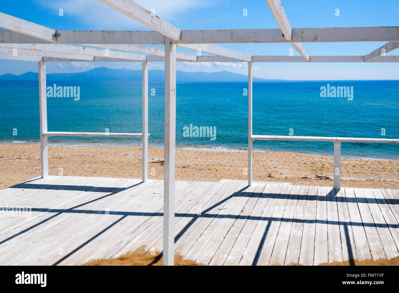 Wooden deck on the beach looking to the sea Stock Photo
