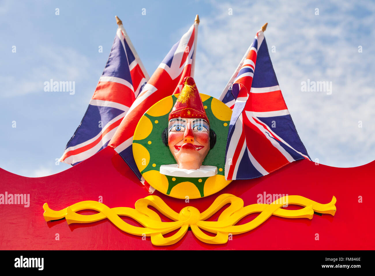 Traditional British Punch and Judy puppet stall top with Union Jack flags Stock Photo