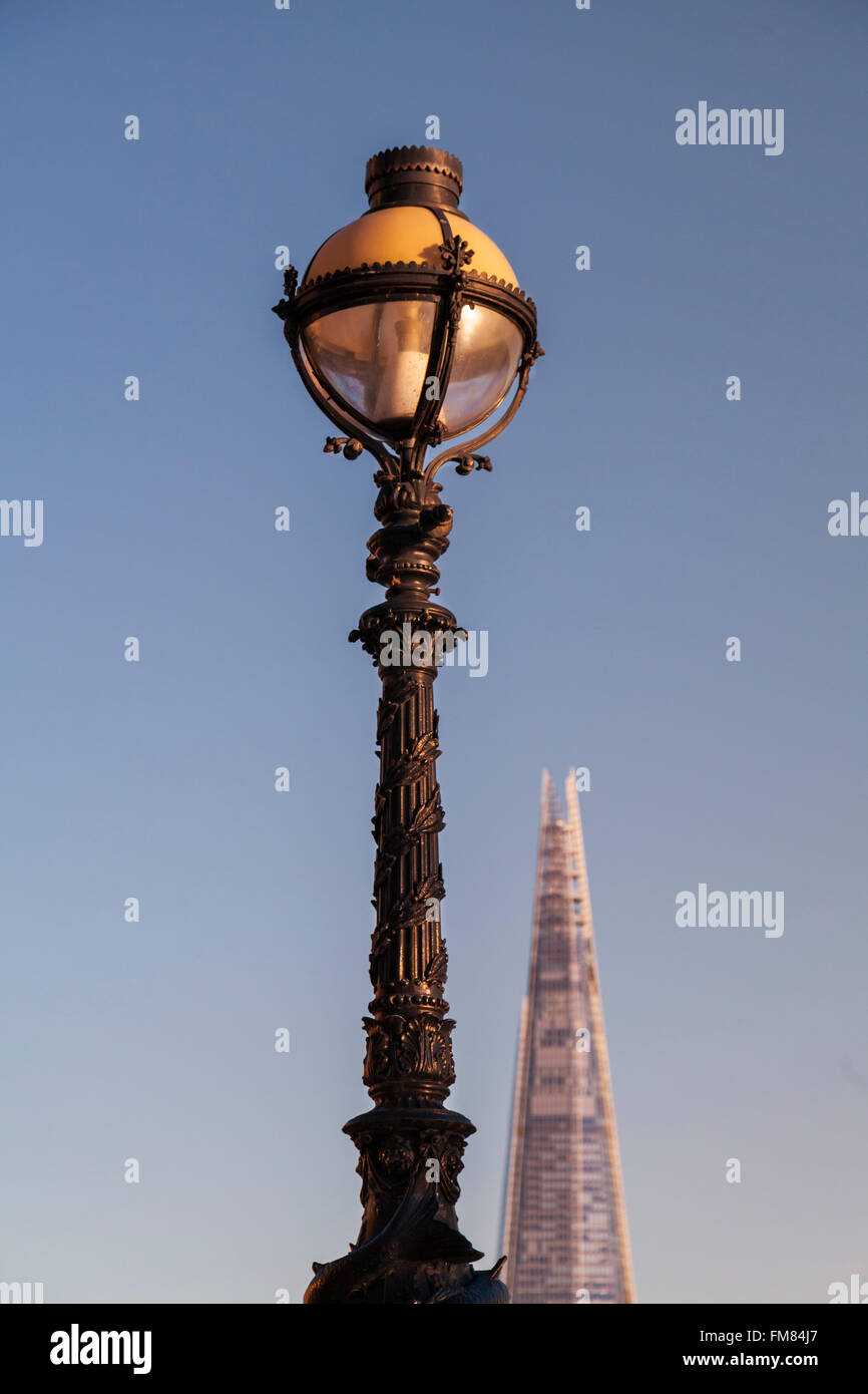 Ornate London lamp post with the modern Shard skyscraper in the background Stock Photo