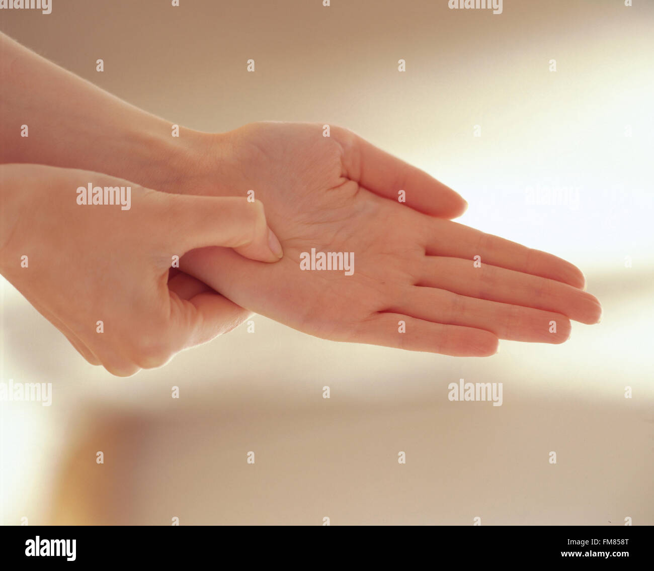 Hook and backup technique, resting wirking thumb on palm of other hand, placing fingers on top