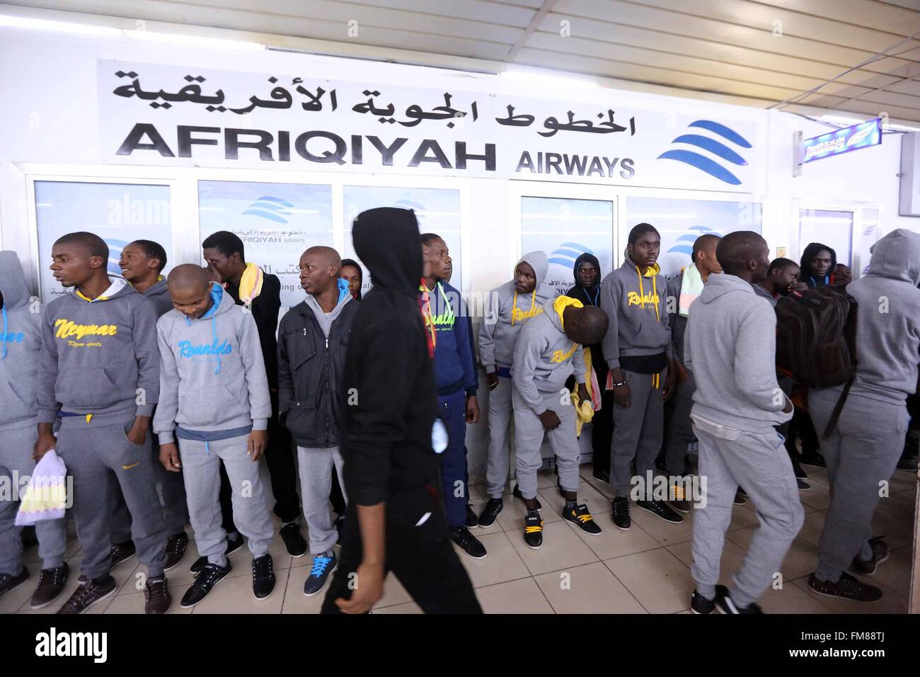 Tripoli, Libya. 11th Mar, 2016. Illegal migrants wait at the Metiga Airport in Libyan capital Tripoli on March 11, 2016, ahead of their repatriation to their countries of origin by the Libyan authorities. Credit:  Hamza Turkia/Xinhua/Alamy Live News Stock Photo