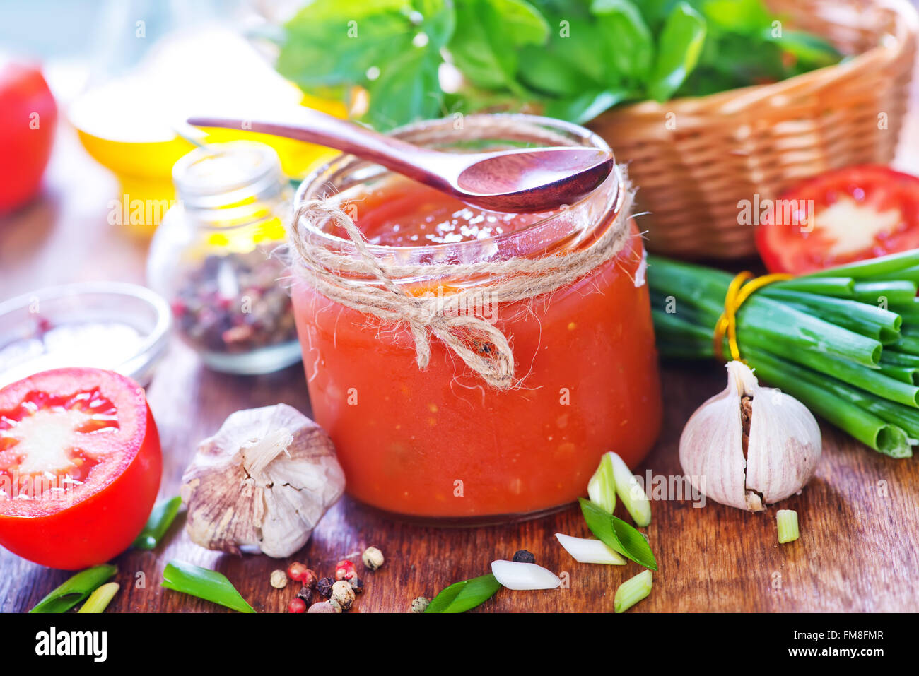 tomato sauce in glass bank and on a table Stock Photo - Alamy