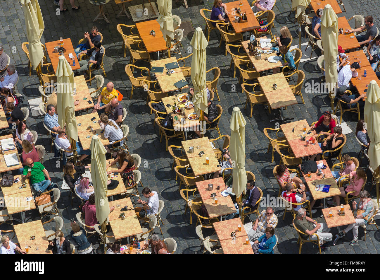 Aerial view of people at an outdoor restaurant from the Astronomical Clock Tower in Prague, Czech Republic. Stock Photo