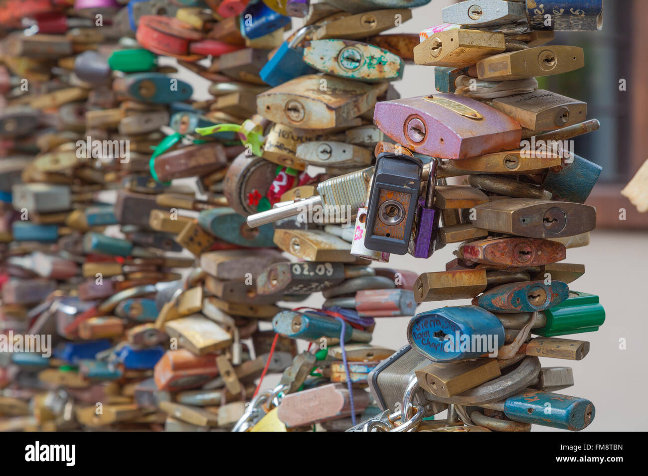 Padlocks attached to railings as a sign of love and affection Stock Photo