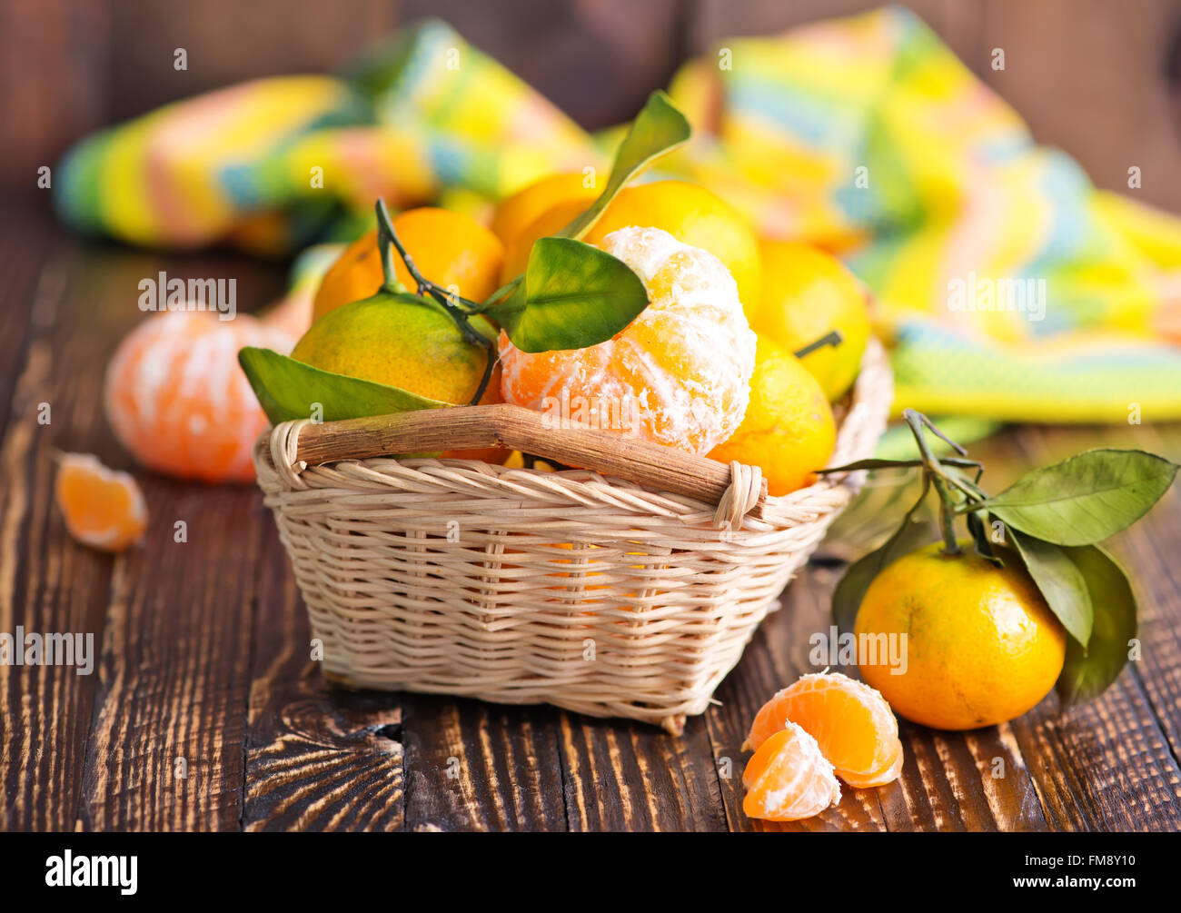 tangerines in basket and on a table Stock Photo Alamy