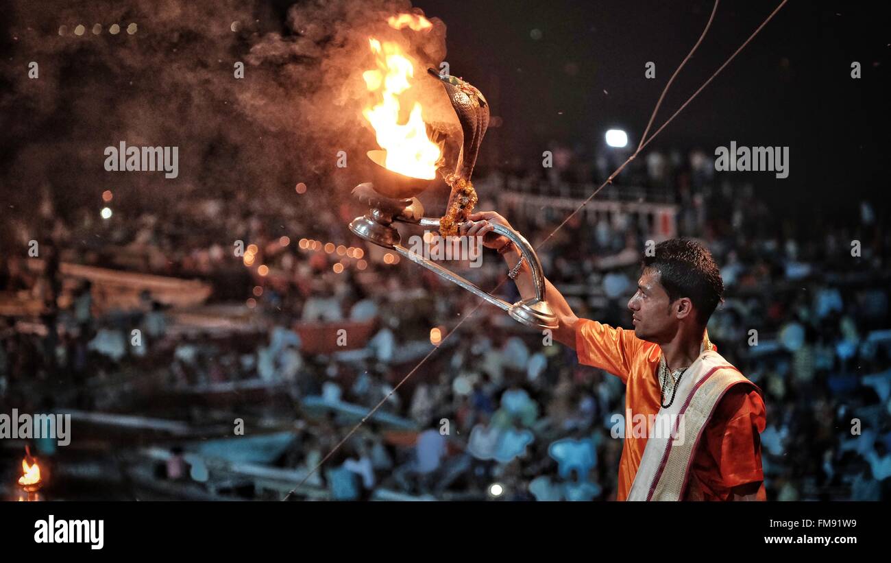 Ganga Aarti, Varanasi, India. 11 March 2016. Thousands gather on the banks of the Ganges and in small boats in the river itself taking part in the Ganga Aarti. The daily celebration takes place at sunset when offerings are made to the Ganges giving thanks for a happy and prosperous life. Credit:  Tom Corban/Alamy Live News Stock Photo