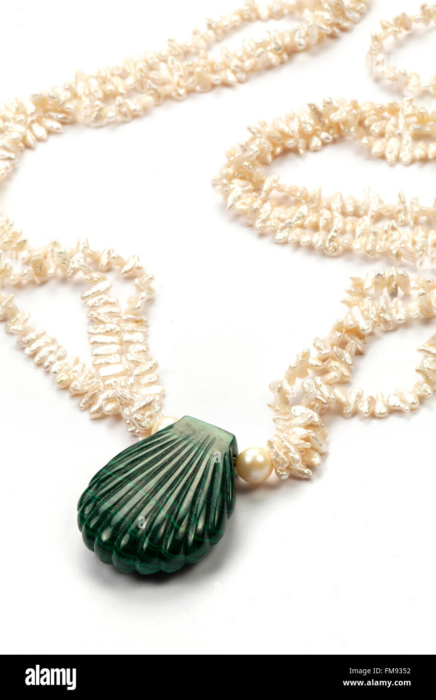 Carved malachite pearl shell and pearls necklace. Stock Photo