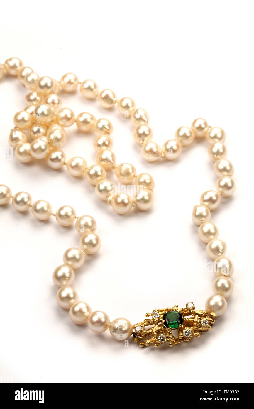 Pearl necklace with gold, diamond and green tourmaline clasp by Andrew Grima? Stock Photo