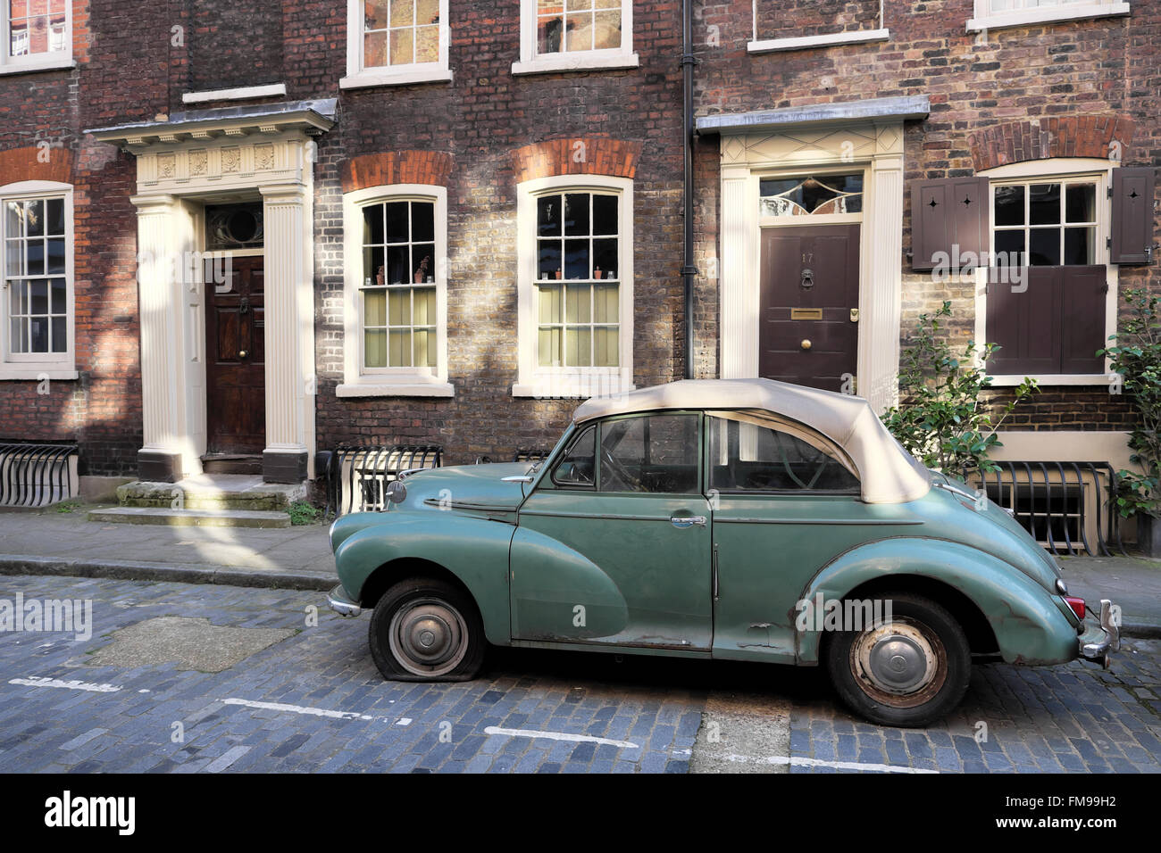 Morris Minor car with a flat tire parked on Elder Street in ...