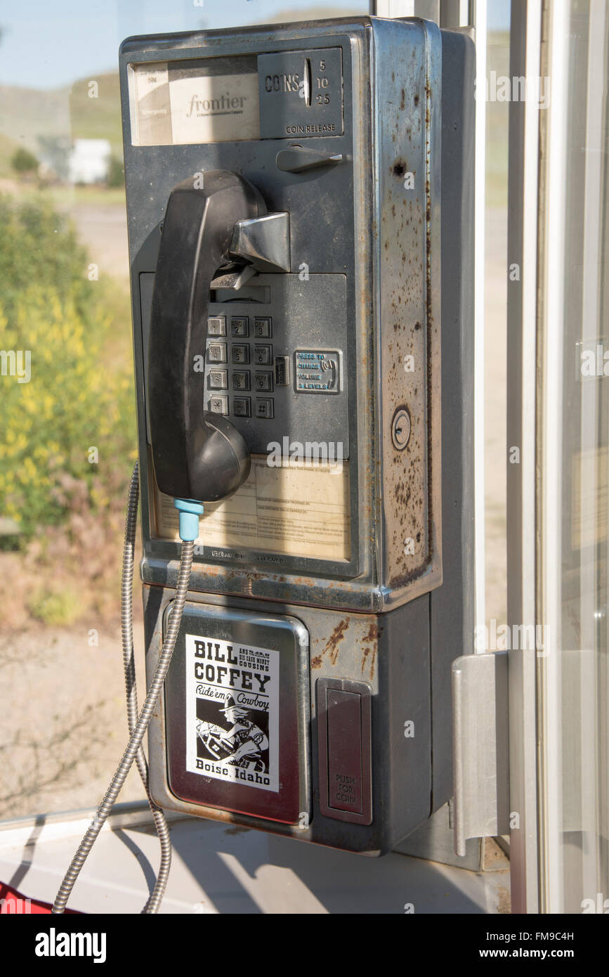 Old Phone Booth in outdoors and old pay phone in booth. USA Stock Photo