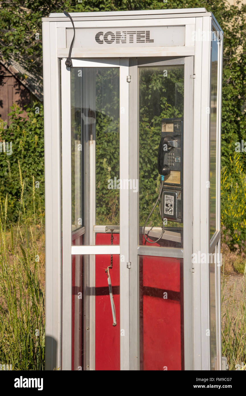 Old Phone Booth in outdoors and old pay phone in booth. USA Stock Photo