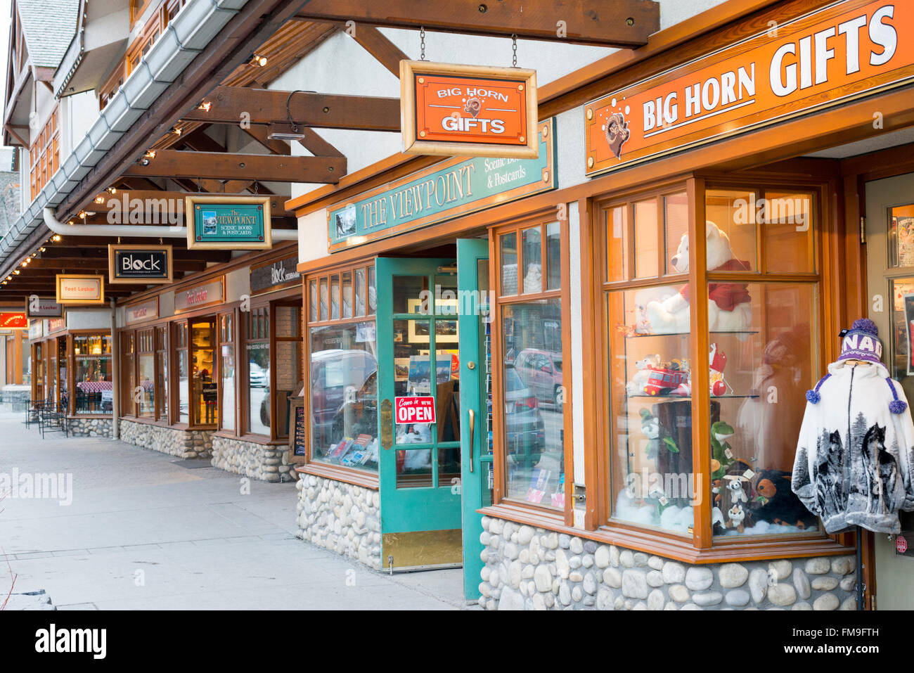 Tourist shops and signs in the main street Banff Avenue Banff Canada Stock Photo