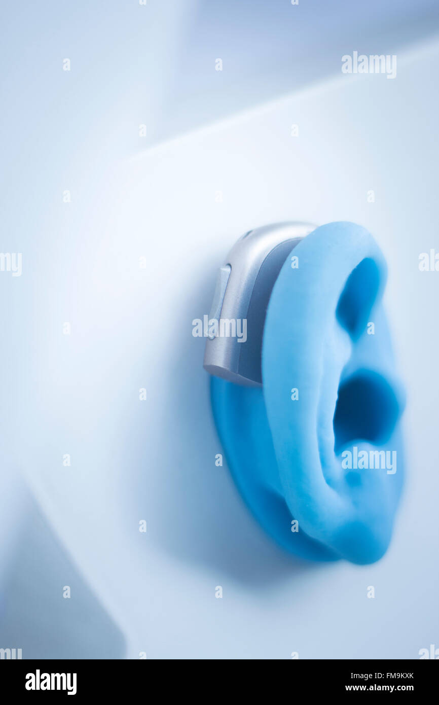 Hearing aid on prosthetic ear in store shop window display Stock Photo Alamy