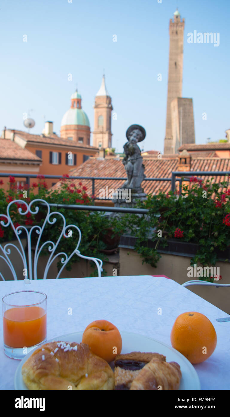 Breakfast in Hotel at morning in Bologna cityscape with towers monument Stock Photo