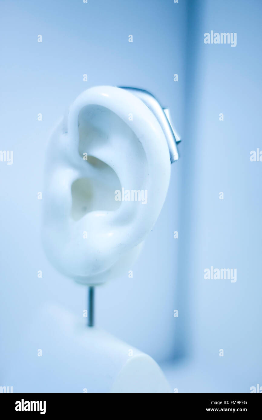 Hearing aid on prosthetic ear in store shop window display Stock Photo Alamy