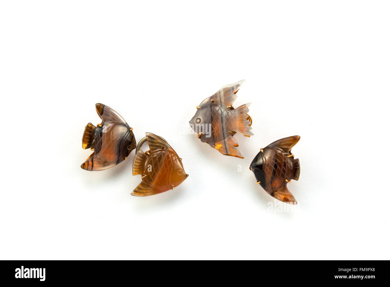 Carved agate angel fish cufflinks. Stock Photo