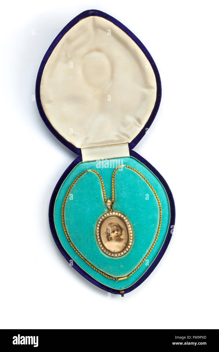 Gold, pearl and enamel miniature Victorian photograph frame pendant necklace in case. Stock Photo