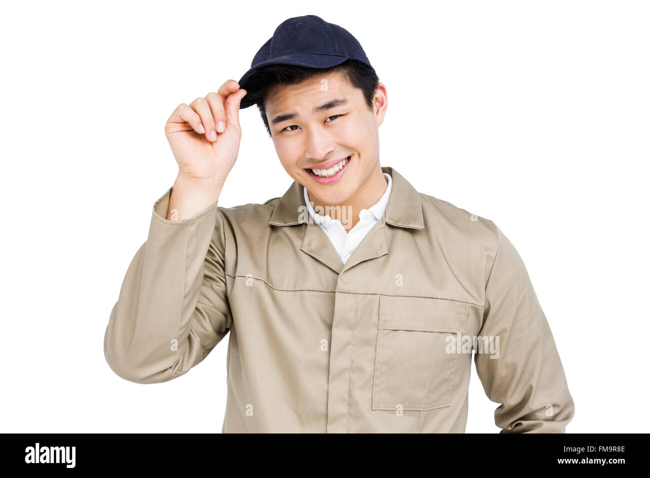 Happy delivery man holding his cap Stock Photo Alamy