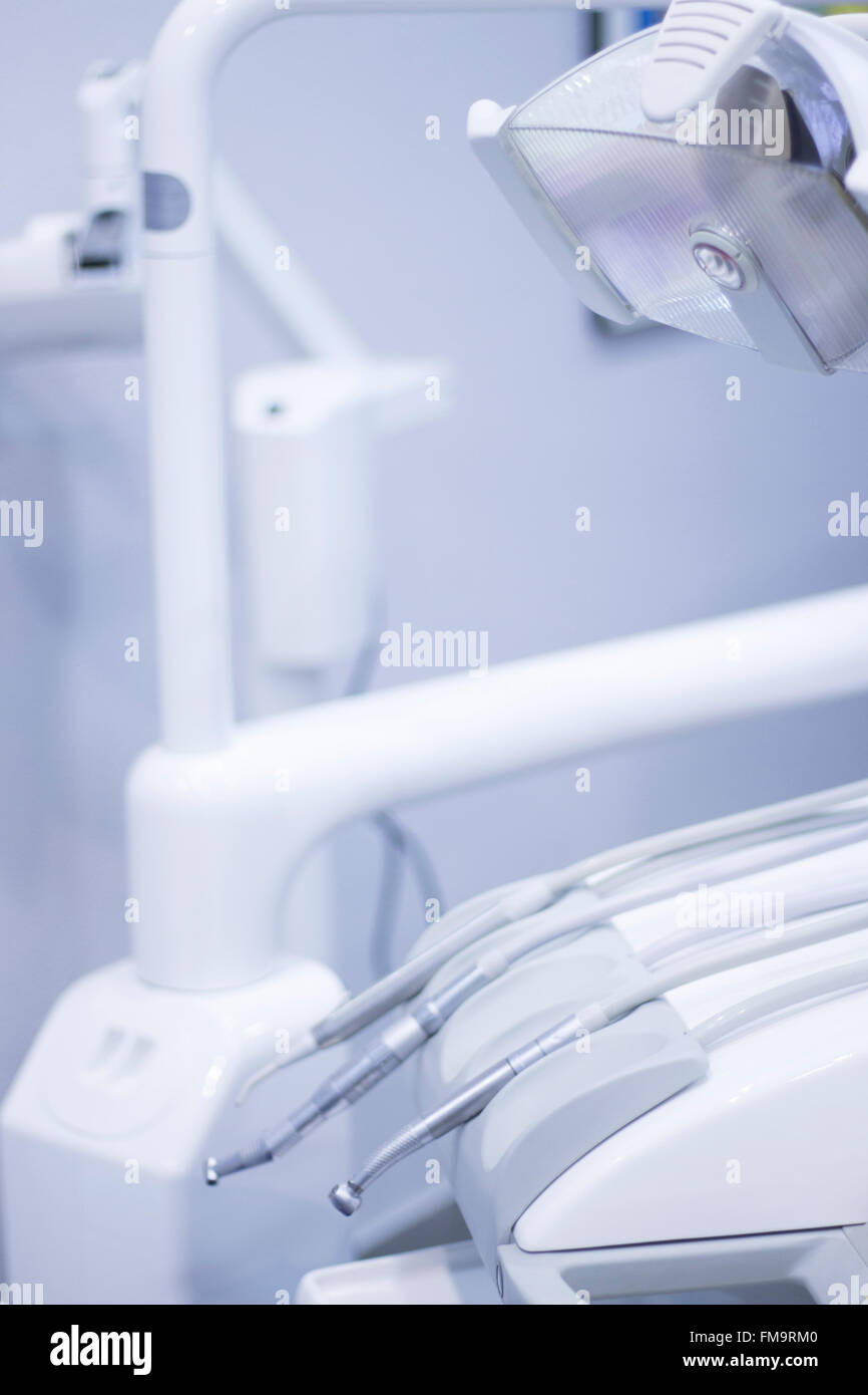 Dentist's chair and dental drill in hospital clinic Stock Photo - Alamy