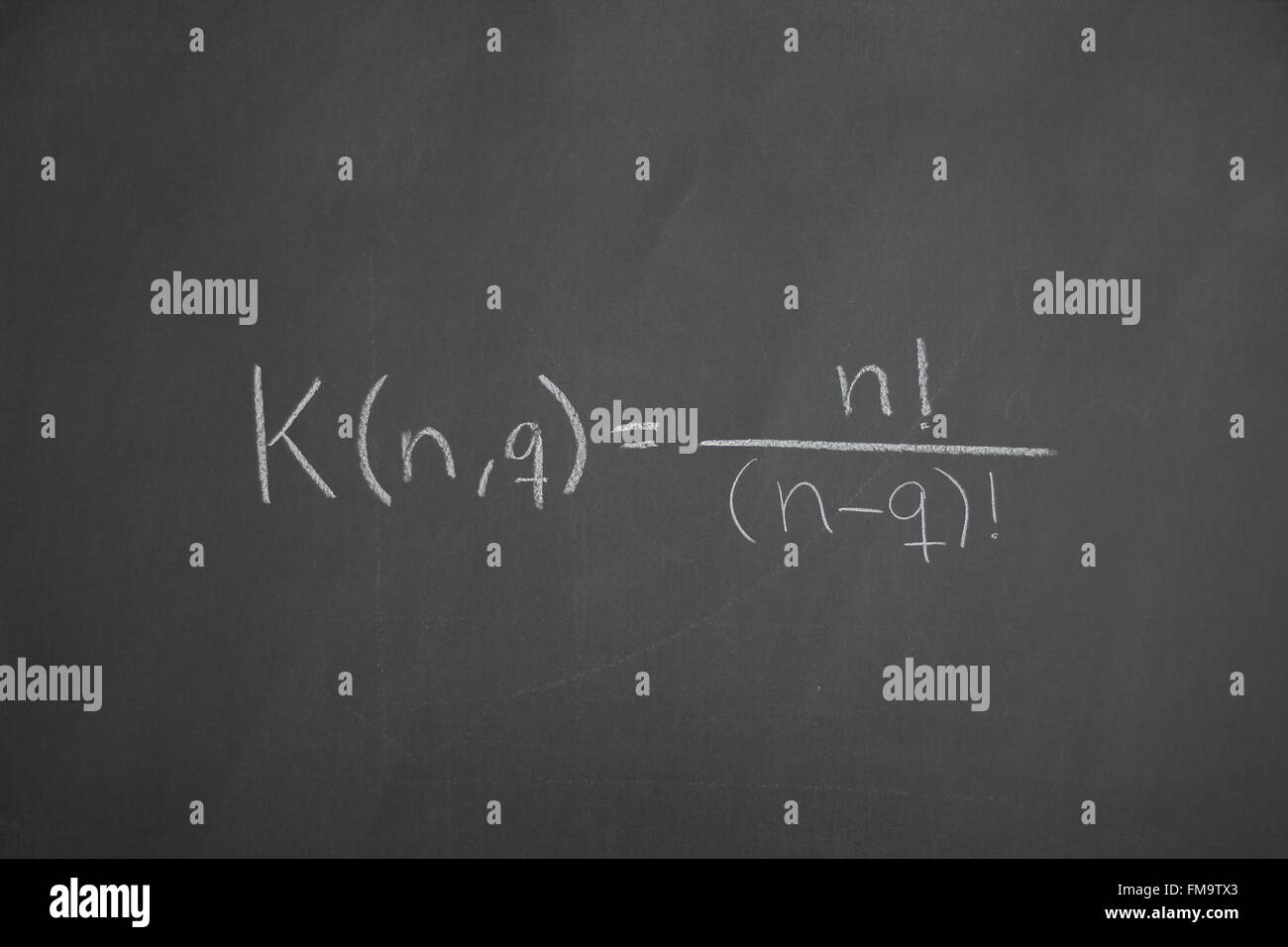 Studying the science of mathematics and economics on a blackboard Stock Photo