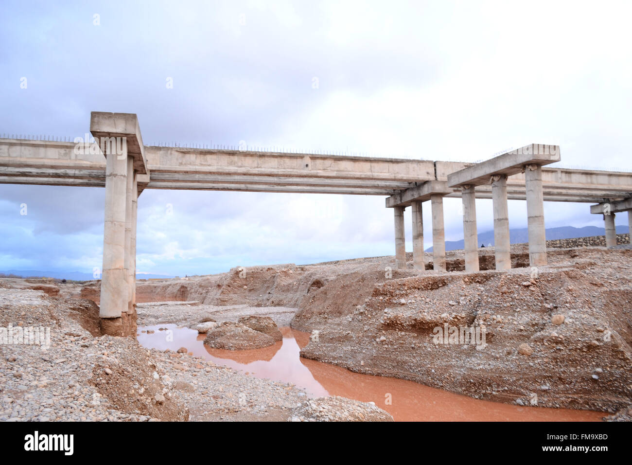 The foundations of the under construction bridge has been washed away in raining for last three days. The National Disaster Management authority 'PDMA' has predicted more rains and flood and has warned the people in the next three day in Quetta Pakistan. Credit:  Din Muhammad Watanpaal/Alamy Live News Stock Photo