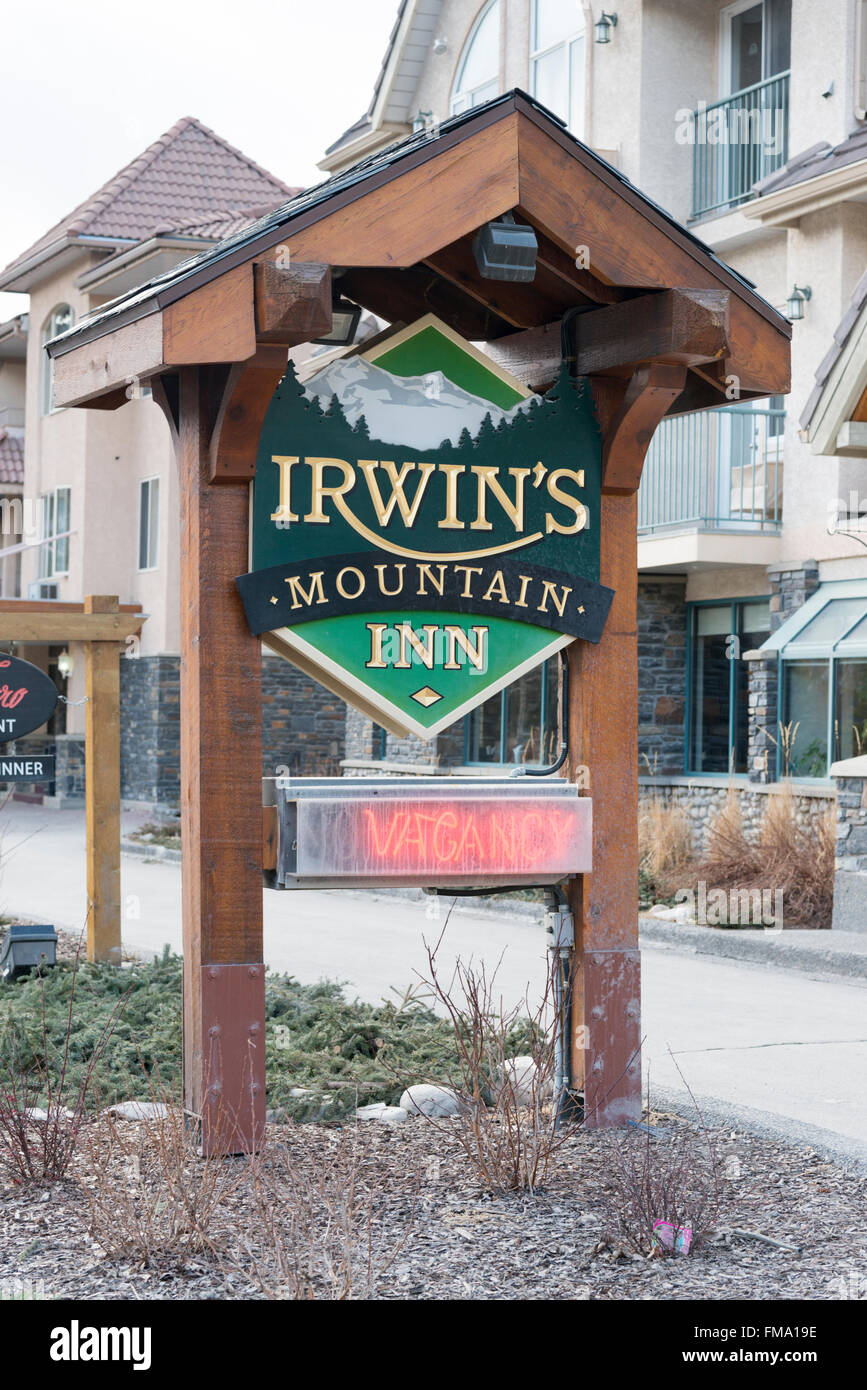 The sign for the Irwins Mountain Inn Banff Canada in winter Stock Photo