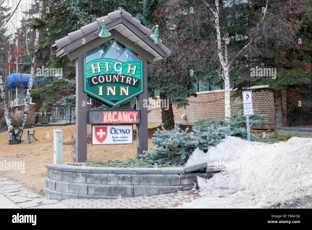 The sign for the High Country Inn Banff Canada in winter Stock Photo