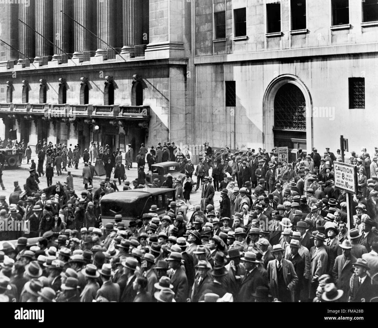 Wall Street Crash. Crowd of people gather outside the New York Stock Exchange following the Crash of 1929, which led to the Great Depression. Stock Photo