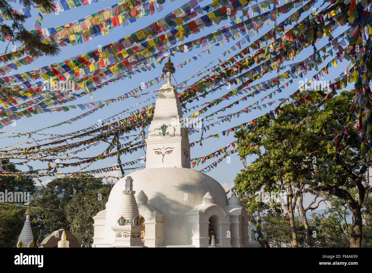 Small buddhist stupa with prayer flags at Swayambunath temple in Kathmandu, Nepal. Stock Photo