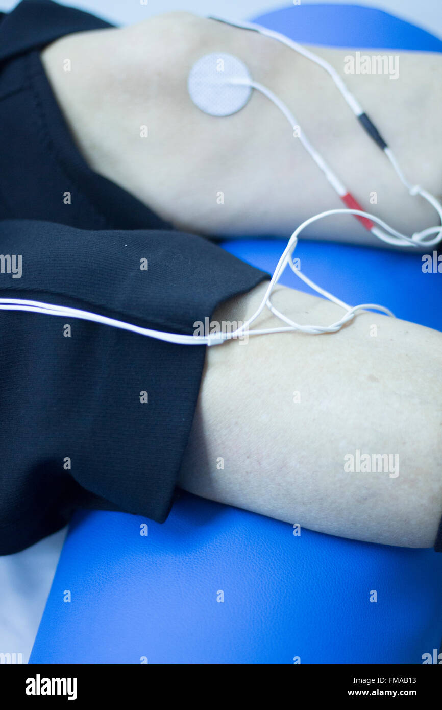 Physical therapy clinic of hospital. Patient having electrical impulse physiotherapy treatment