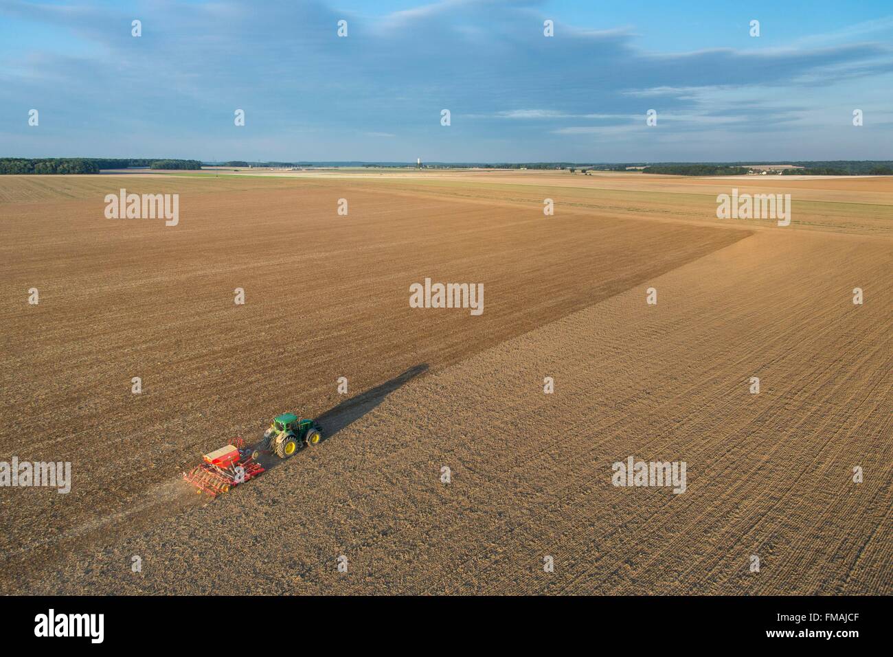 France, Eure, Saint Aubin sur Gaillon, seed sowing with pneumatic seed drill (aerial view) Stock Photo