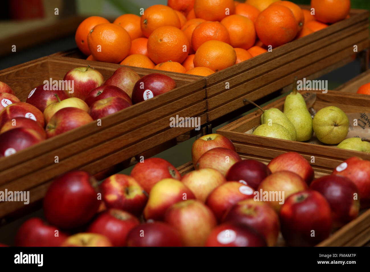 Oranges, apples and pears on display in a school café in Brighton, East Sussex, UK. Stock Photo