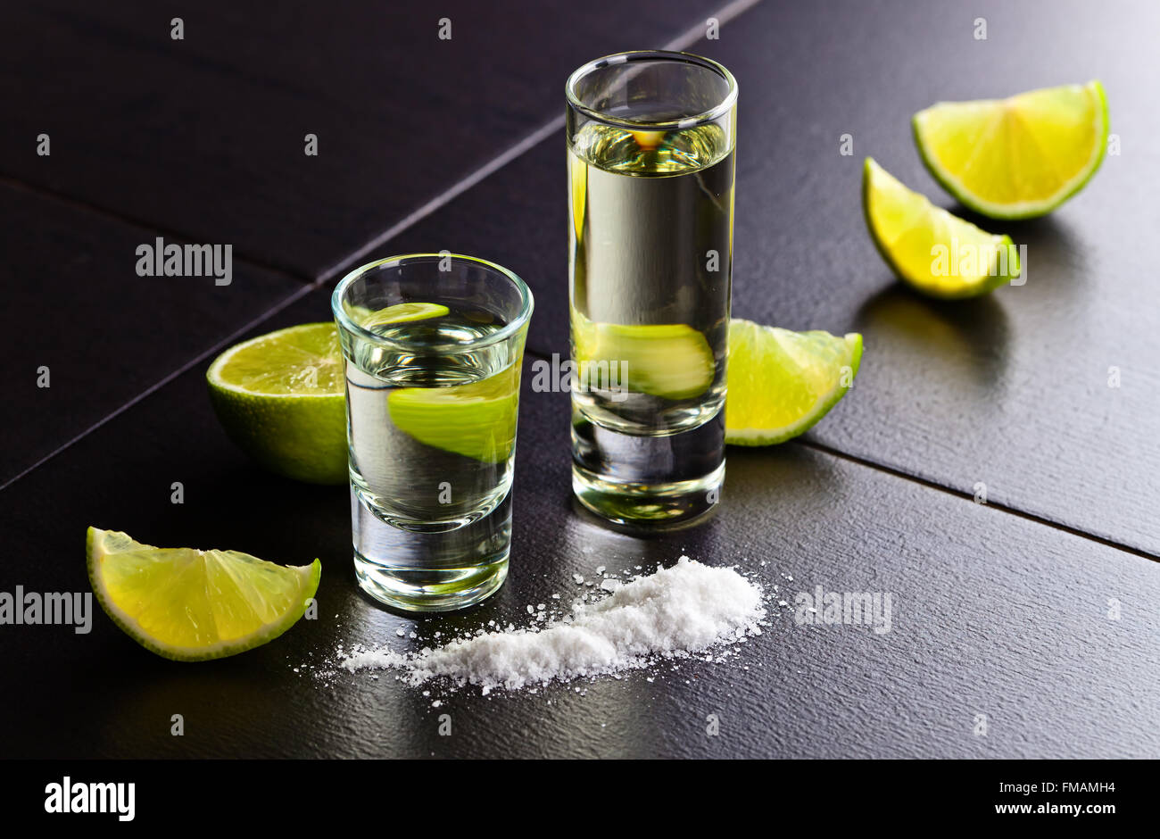 tequila , lime and salt on black table Stock Photo Alamy