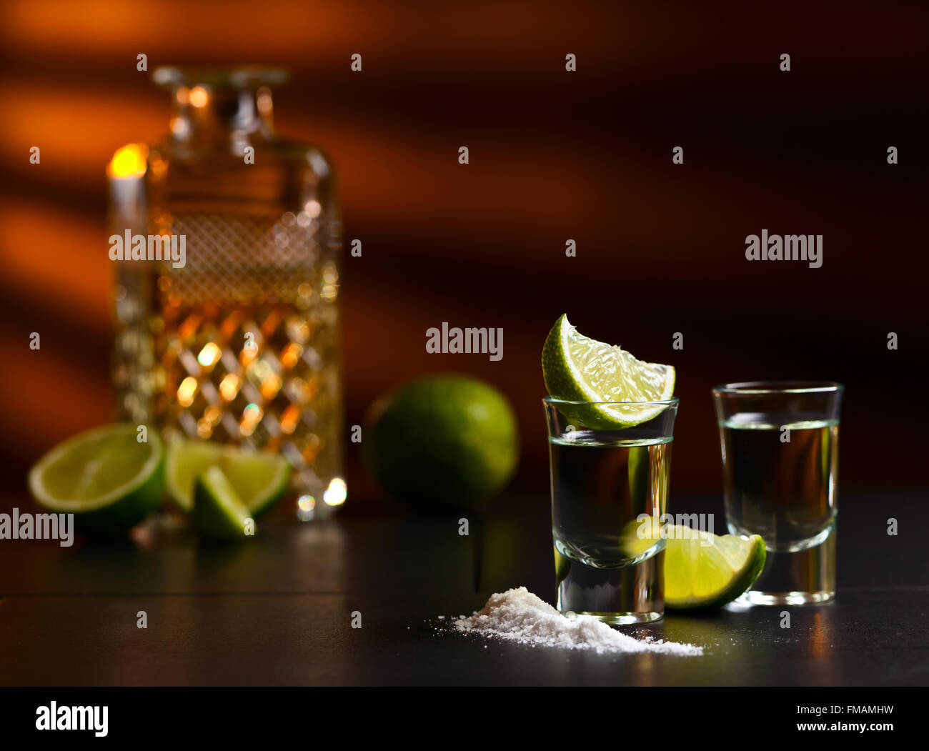 tequila , lime and salt on black table Stock Photo Alamy