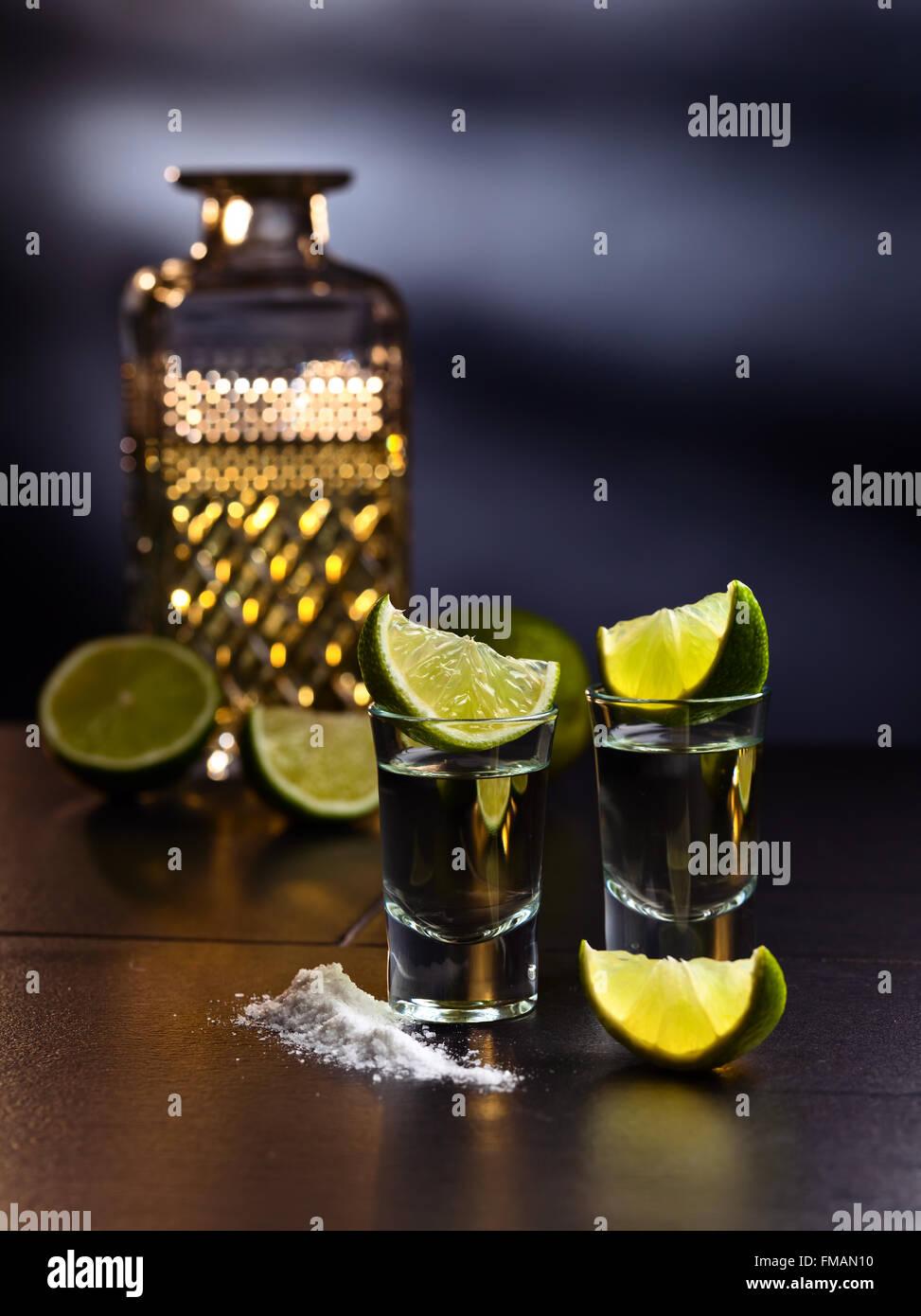 tequila , lime and salt on black table Stock Photo Alamy