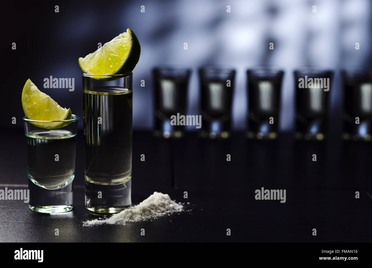 tequila , lime and salt on black table Stock Photo Alamy