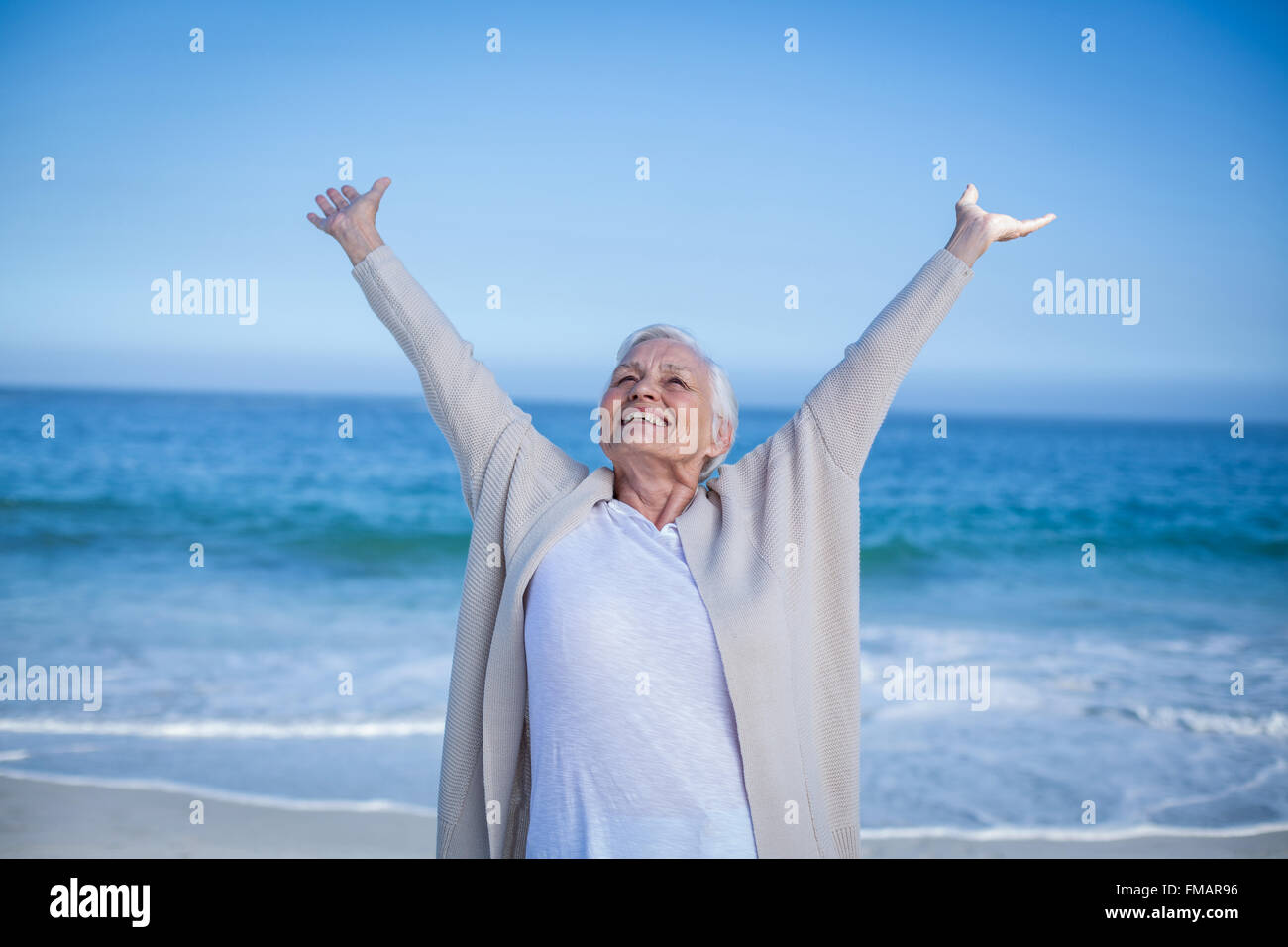 Mature woman outstretching arms hi-res stock photography and images - Alamy