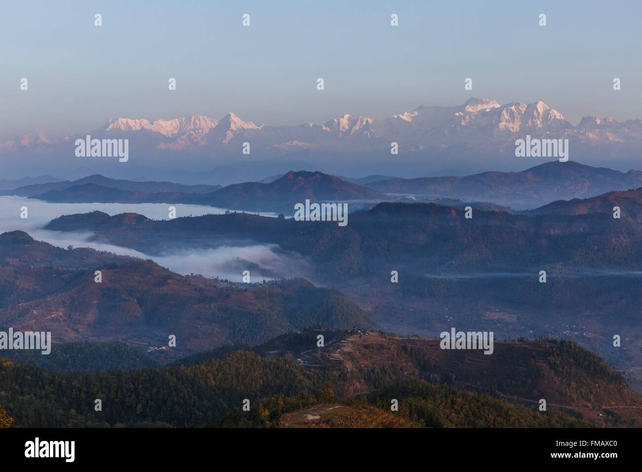 Nepal, Gandaki zone, Bandipur, Himalaya mountains and mist in the valley at sunrise Stock Photo