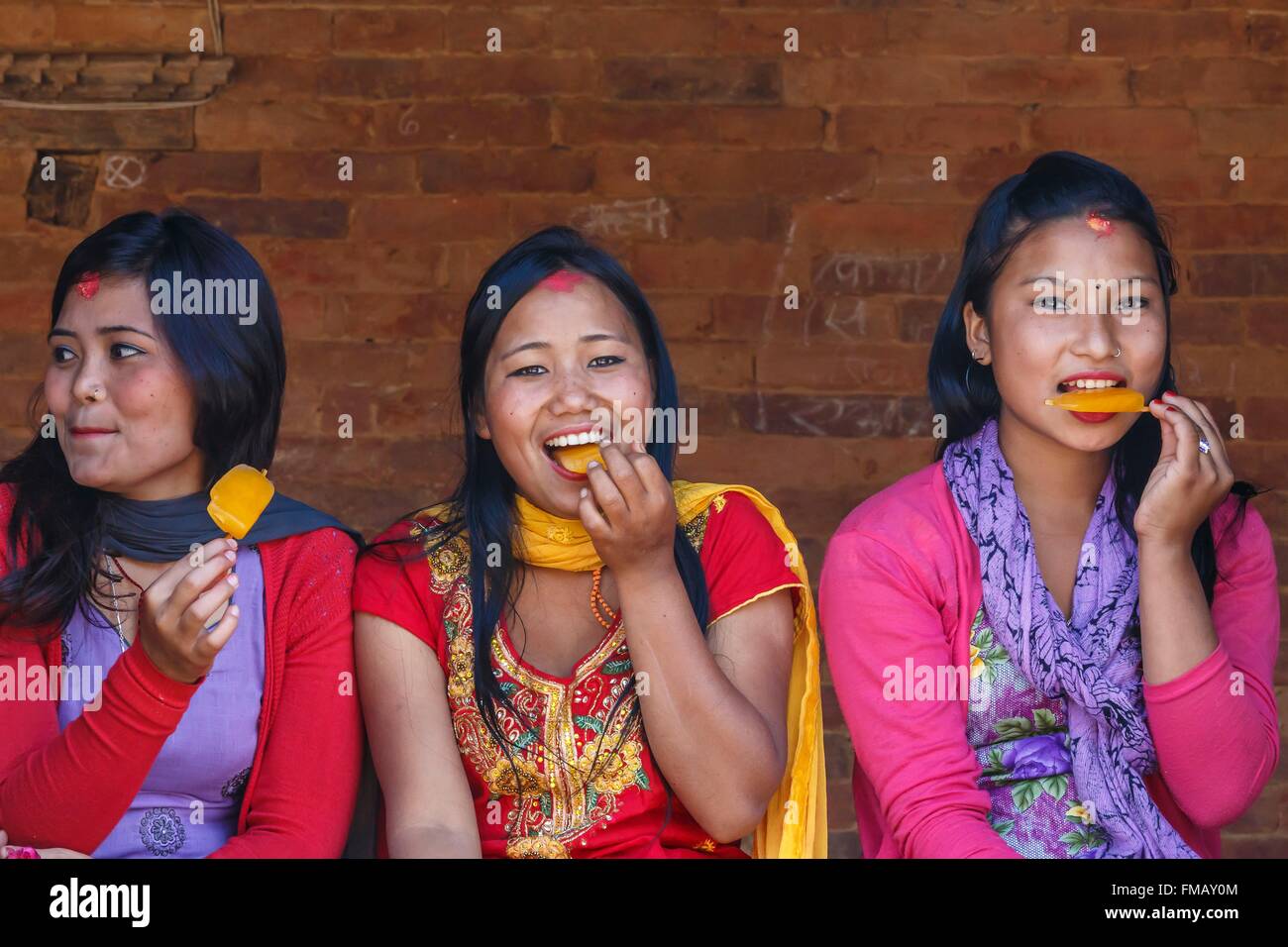 Nepal, Bagmati zone, Nuwakot, girls eating ice cream Stock Photo