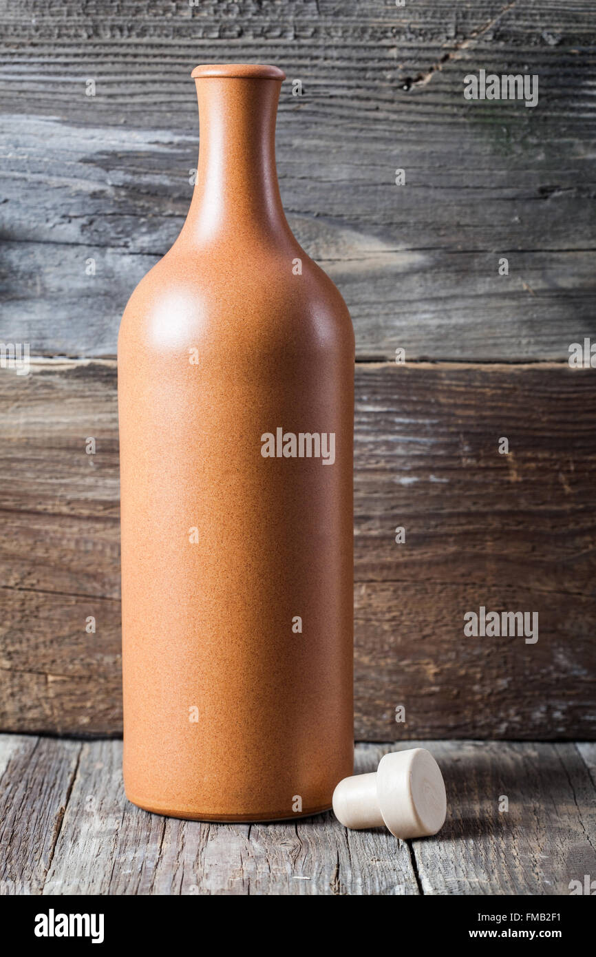 Download Ceramic Bottle With Cork On Old Wood Background Stock Photo Alamy Yellowimages Mockups