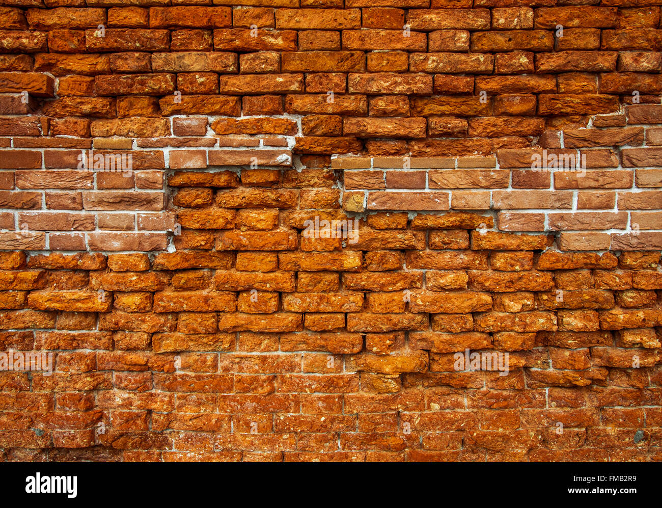 Orange red old brick wall texture weathered Stock Photo - Alamy
