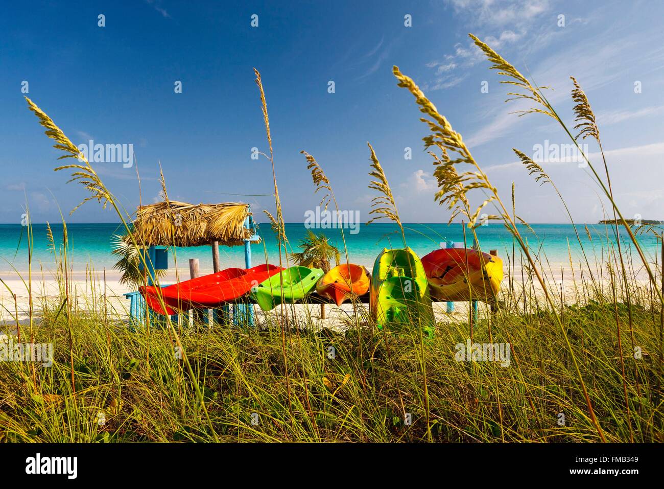 Cuba, Ciego de Avila, Jardines del Rey, Cayo Guillermo, View of beach with turquoise waters with colorful canoes Stock Photo