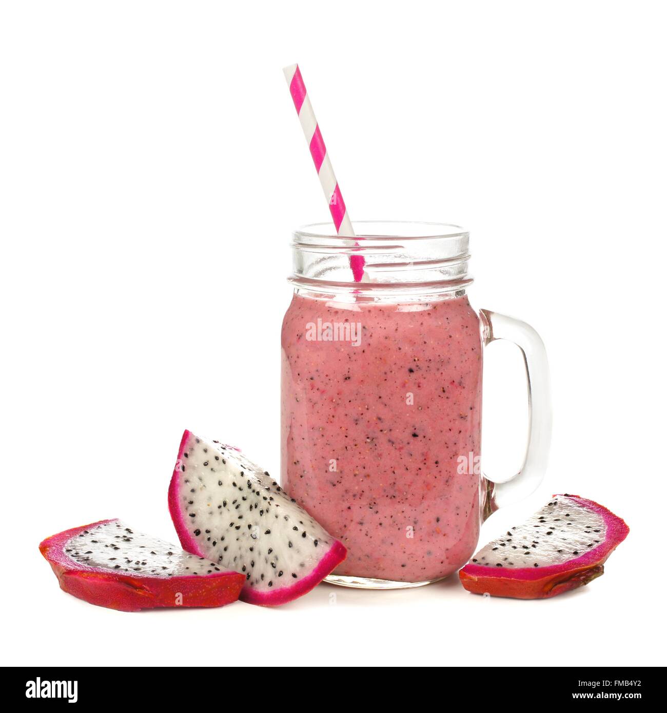 Pink raspberry, dragon fruit smoothie in jar mug with fruit slices isolated on white Stock Photo